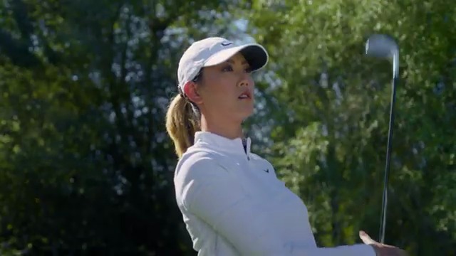 Michelle Wie West mid-swing during a Tonal Golf training piece